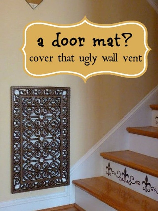 Genius Ways To Hide The Eyesores In Your Home - Repurposed door mat to cover and ugly wall vent