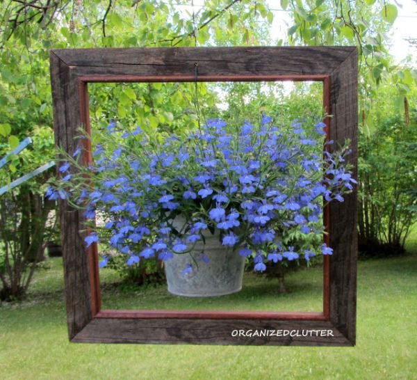 20 Fabulous Art DIY Garden Projects for This Spring - hanging pot flowers in a frame