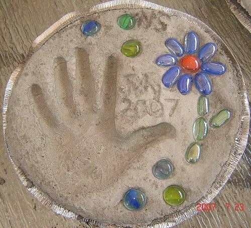 Hand & Footprint Art DIY Ideas and Projects - how to diy your own handprint garden stepping stone tutorial