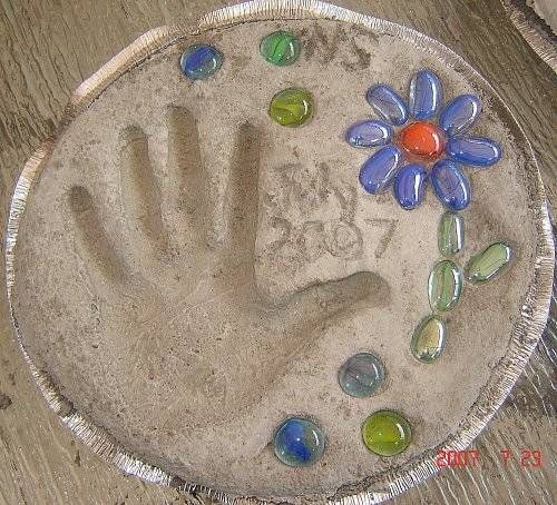 Hand & Footprint Art DIY Ideas and Projects - how to diy your own handprint garden stepping stone tutorial