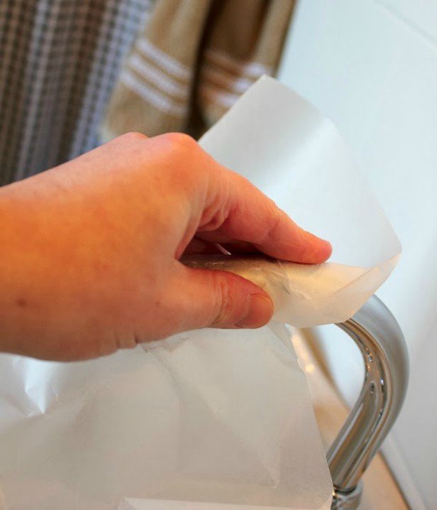 16 DIY Cleaning Hacks - Rub wax paper to clean faucets shiny