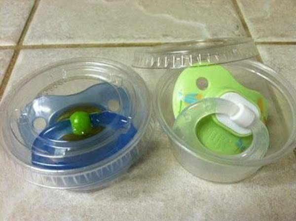 20+ Genius Parenting Hacks That Make Parenting So Much - sauce container or ziplock to keep pacifiers clean Easier